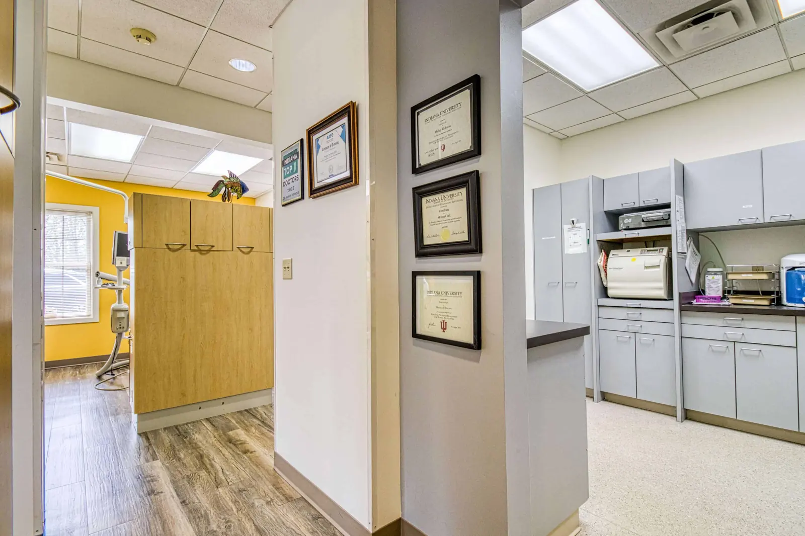 A long practice corridor with treatment room doors either side