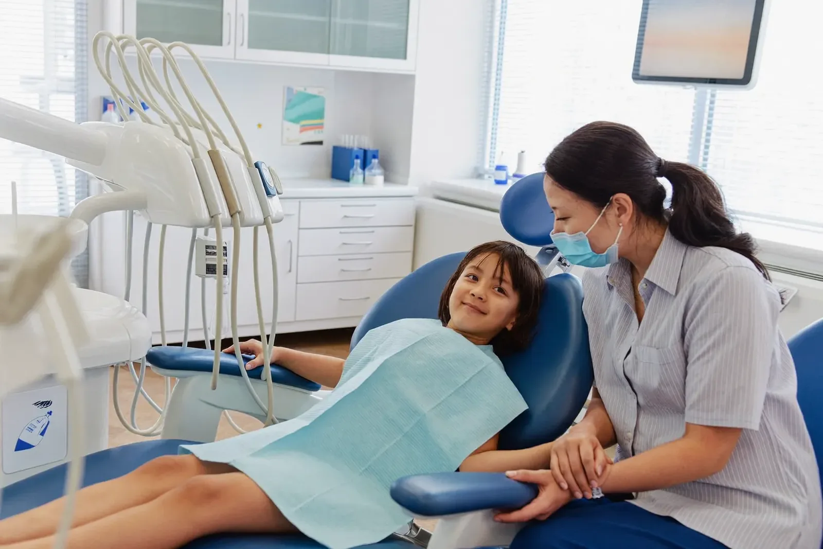 A parent and child in the Northline Dental waiting area