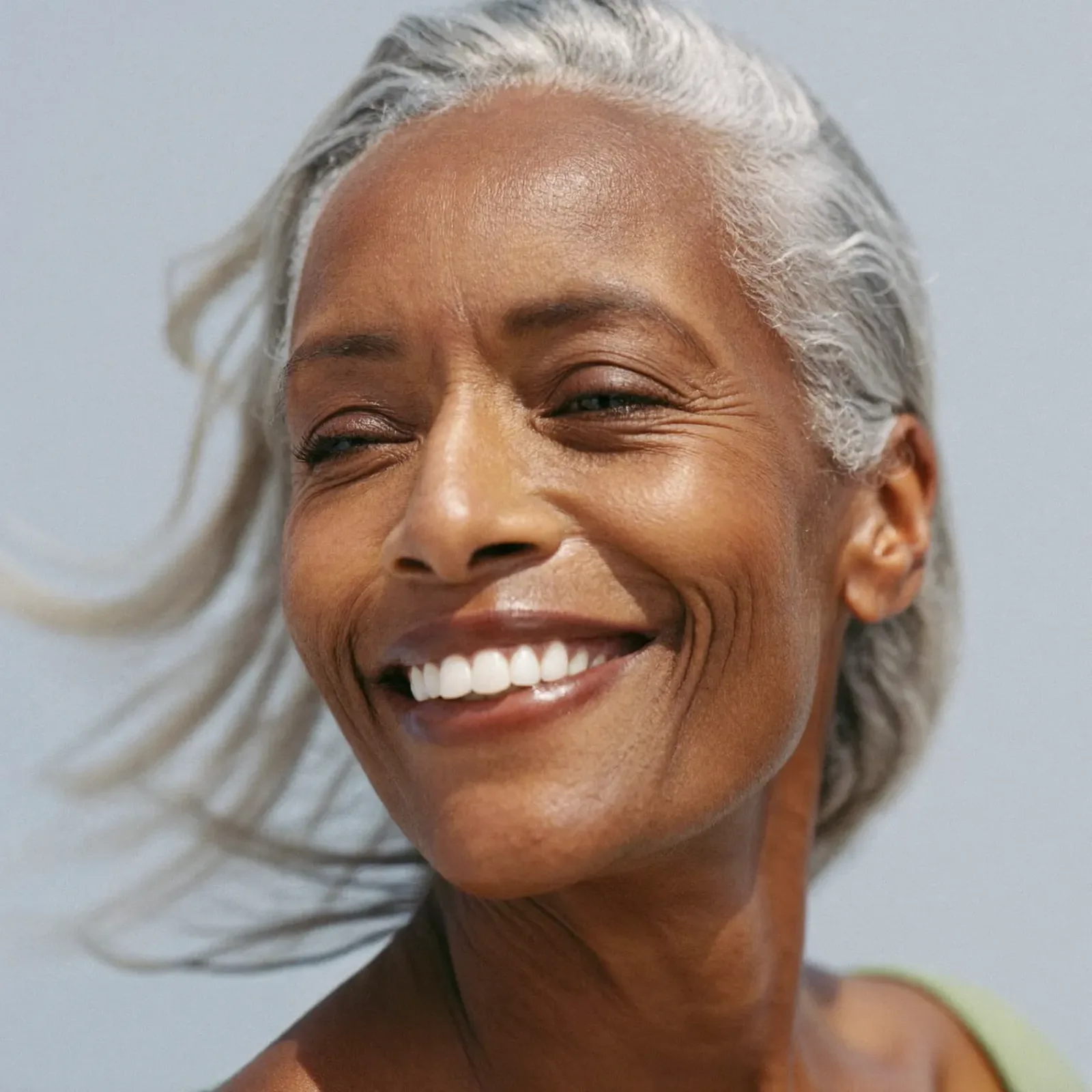 A patient smiling after treatment