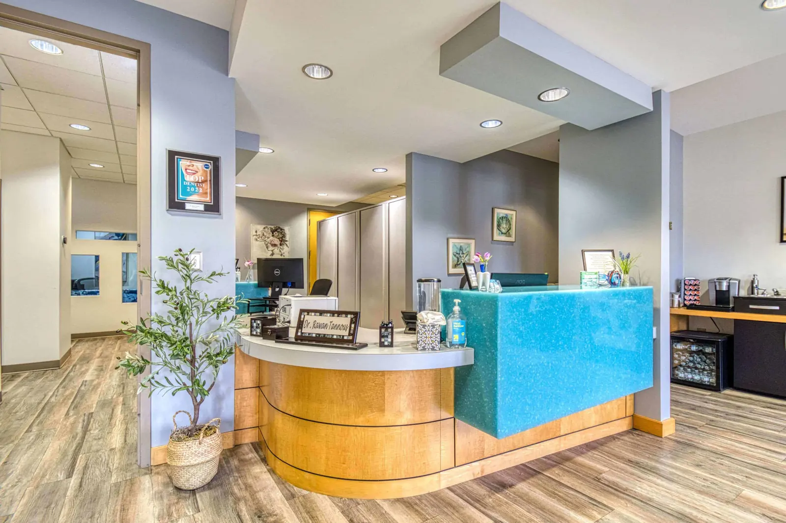 The reception desk of a dental practice, seen from the waiting area