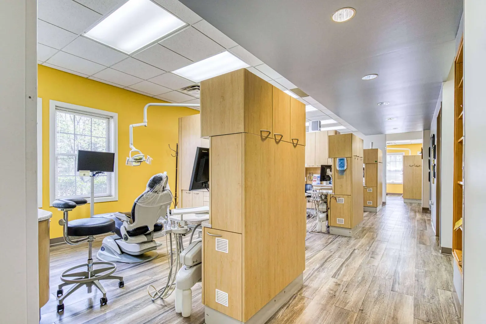 An open treatment bay with two chairs and daylight